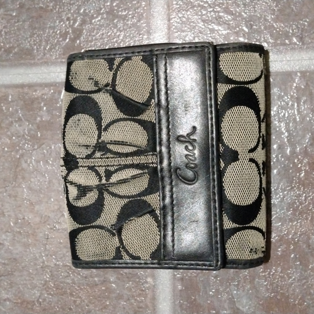 Coach signature black compact With plenty card slots and coin cash compartment.